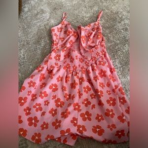 Hesperu Pink Floral Romper. Front tie with part of the stomach out. Size Medium